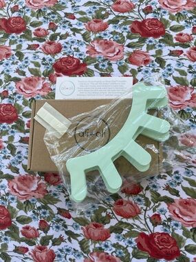 ali+oli Sleepy Eyes Wooden Wall Decor in a Mint Finish